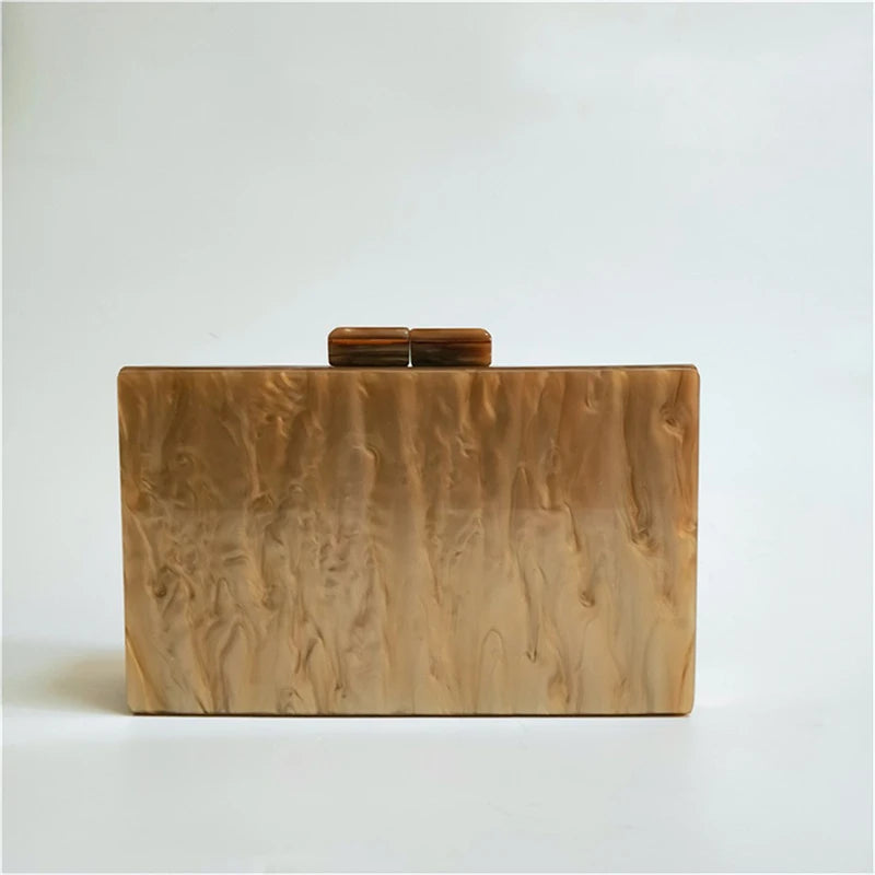 Back view of the Deco Lux Clutch, showcasing the smooth, marbled ivory acrylic finish.