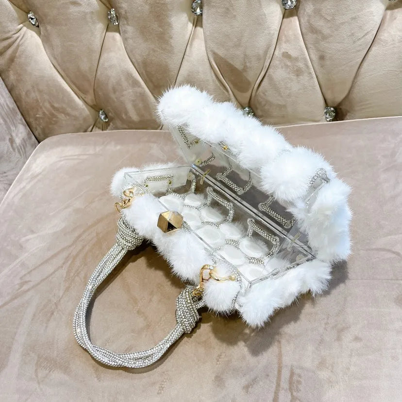 Soirée Éclat Clutch in Blanc Étoile, showcasing open white fur and detailed design.